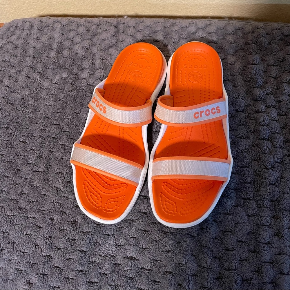 Crocs slide orange with white bands bought for daughter but to big